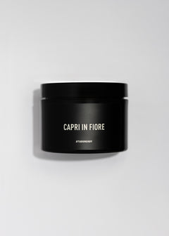 Capri in Fiore Erogenous Body Scrub jar with black label on a light background