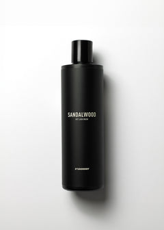 Black Sandalwood Exfoliating Lava Body Wash bottle on a white background